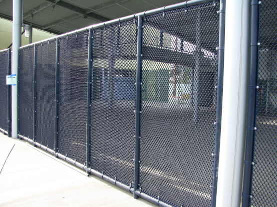 These blue vinyl coated chain link panels were installed at a Los Angeles School. The mesh is 1/2