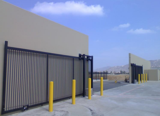 We installed large double wrought iron roll gates with gate operators and access controls. The bollards were installed to protect the gates.
