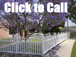 Vinyl picket fence installed between brick pilasters in San Pedro CA.