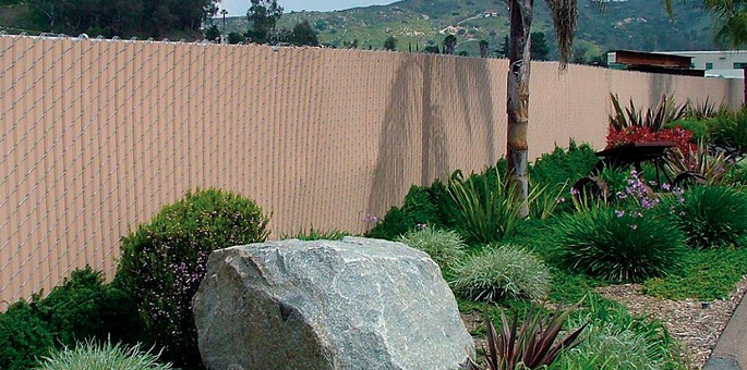This is Privacy Link fencing - chain link wire with pre-woven slats. A great economical choice for privacy.