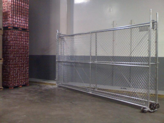 These are chain link bifolding gates installed at long time client Coca Cola. Bi-fold gates are the answer to areas where space is at a premium